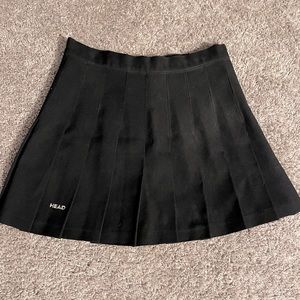 Head black tennis skirt.  Size 8